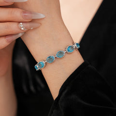 Silver-tone tennis bracelet with oval blue zircon stones — Azure Oval Zircon Tennis Bracelet.
