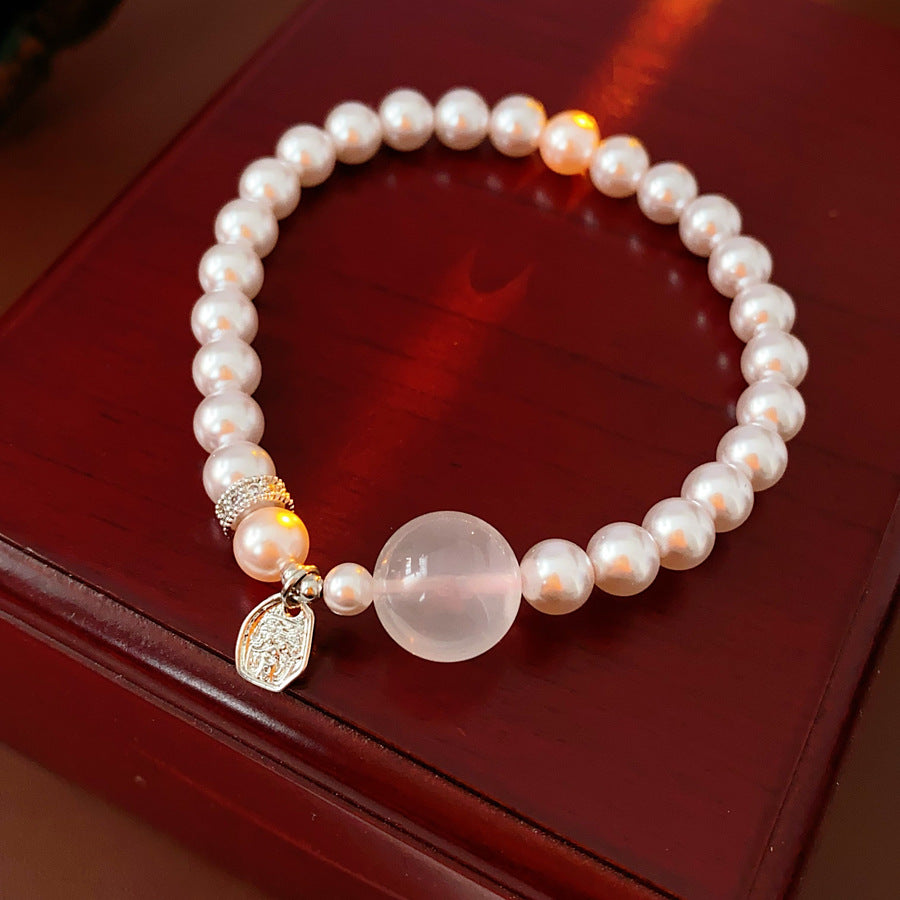 Shijia pearl beaded bracelet with crystal orb focal, zircon spacer and silver-tone coin charm — Moonlit Pearl Charm Bracelet.