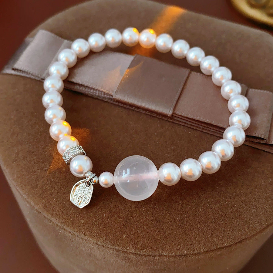 Shijia pearl beaded bracelet with crystal orb focal, zircon spacer and silver-tone coin charm — Moonlit Pearl Charm Bracelet.