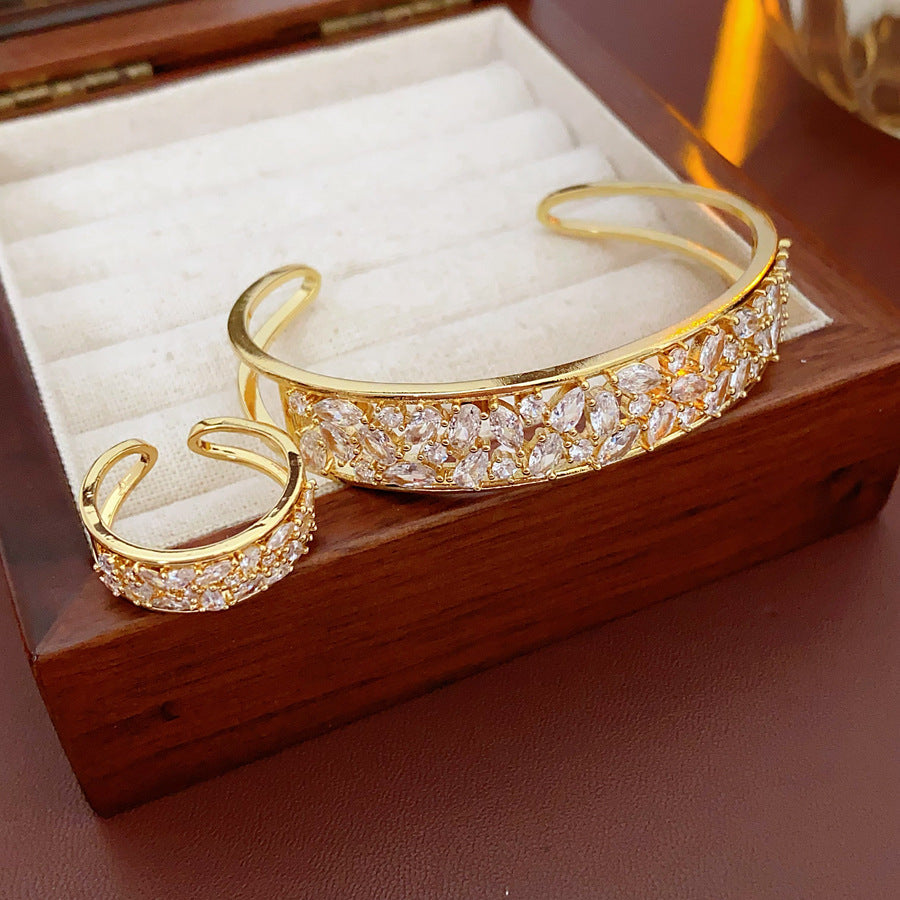 Gold and silver open cuff bracelet with matching pavé ring, set with sparkling zircons — Starlight Pavé Cuff Set by Glazenya.