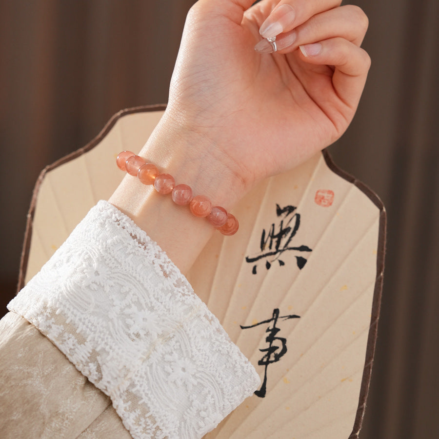 Peach-toned natural red agate beaded bangle with glossy round stones — Peach Glow Agate Bangle.