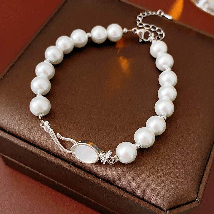 Serpentine Pearl Elegance Bracelet with glass pearls and shell accents on green box – Glazenya jewelry