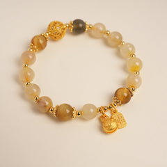 Crystal beaded bracelet with gold-tone accents and fortune & ingot charms, light-luxury style
