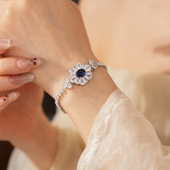 Starlit Dahlia Bracelet with blue oval gemstone and zircon floral halo – Glazenya jewelry
