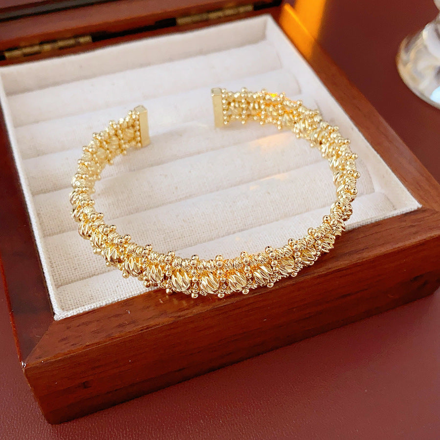 Gold and silver textured open cuff bangles with a lace-like granulated surface — Starlit Lace Cuff Bracelet.