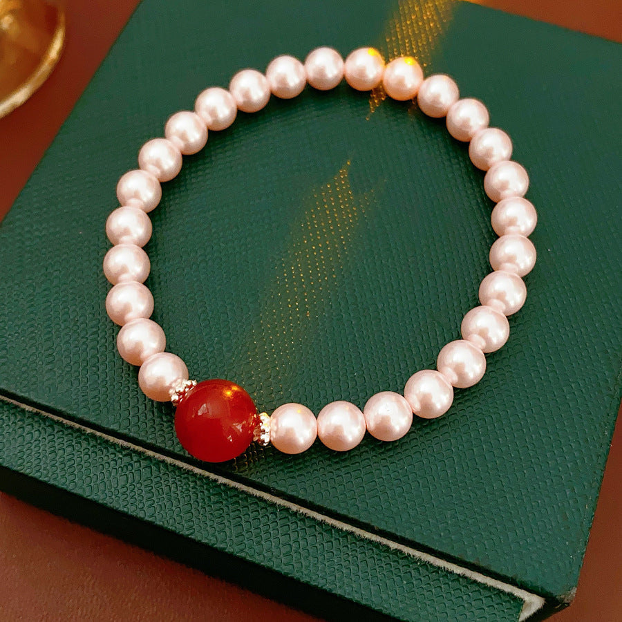 Blush Shijia pearl bracelet with a crimson agate centerpiece and pavé spacers — Crimson Kiss Pearl Bracelet by Glazenya.