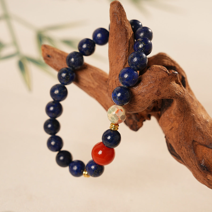 Lapis lazuli beaded bracelet with red accent bead and gold spacers — Midnight Sun Lapis Bracelet by Glazenya.