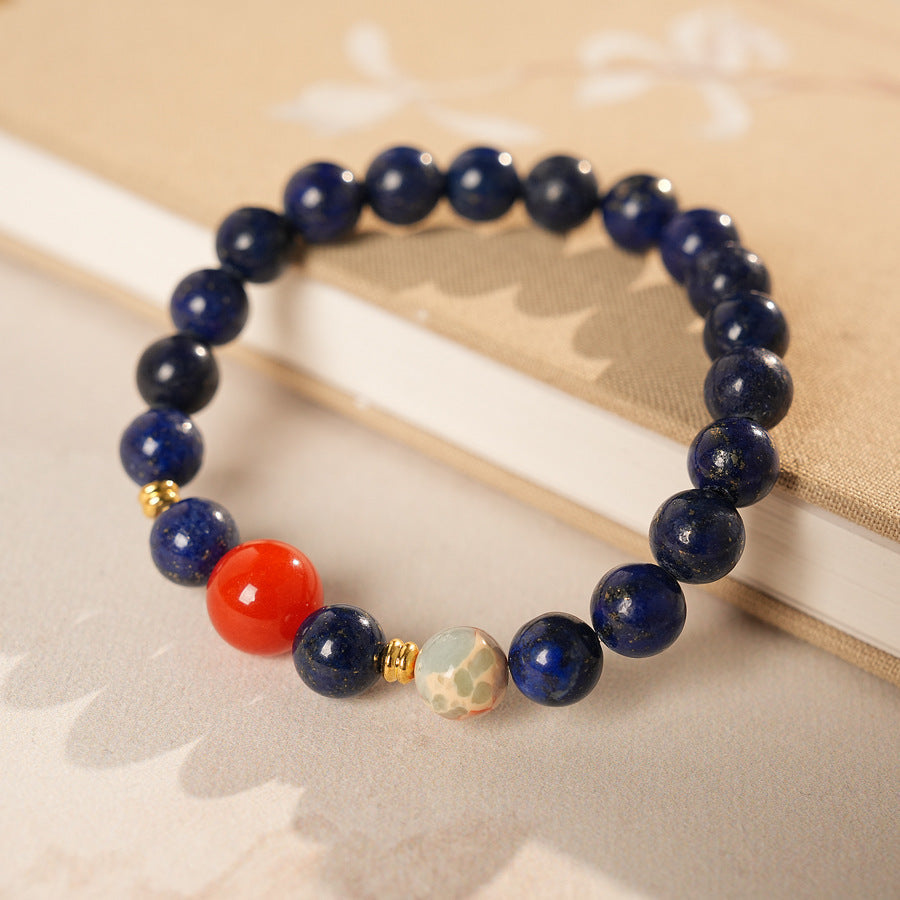 Lapis lazuli beaded bracelet with red accent bead and gold spacers — Midnight Sun Lapis Bracelet by Glazenya.