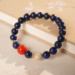 Lapis lazuli beaded bracelet with red accent bead and gold spacers — Midnight Sun Lapis Bracelet by Glazenya.