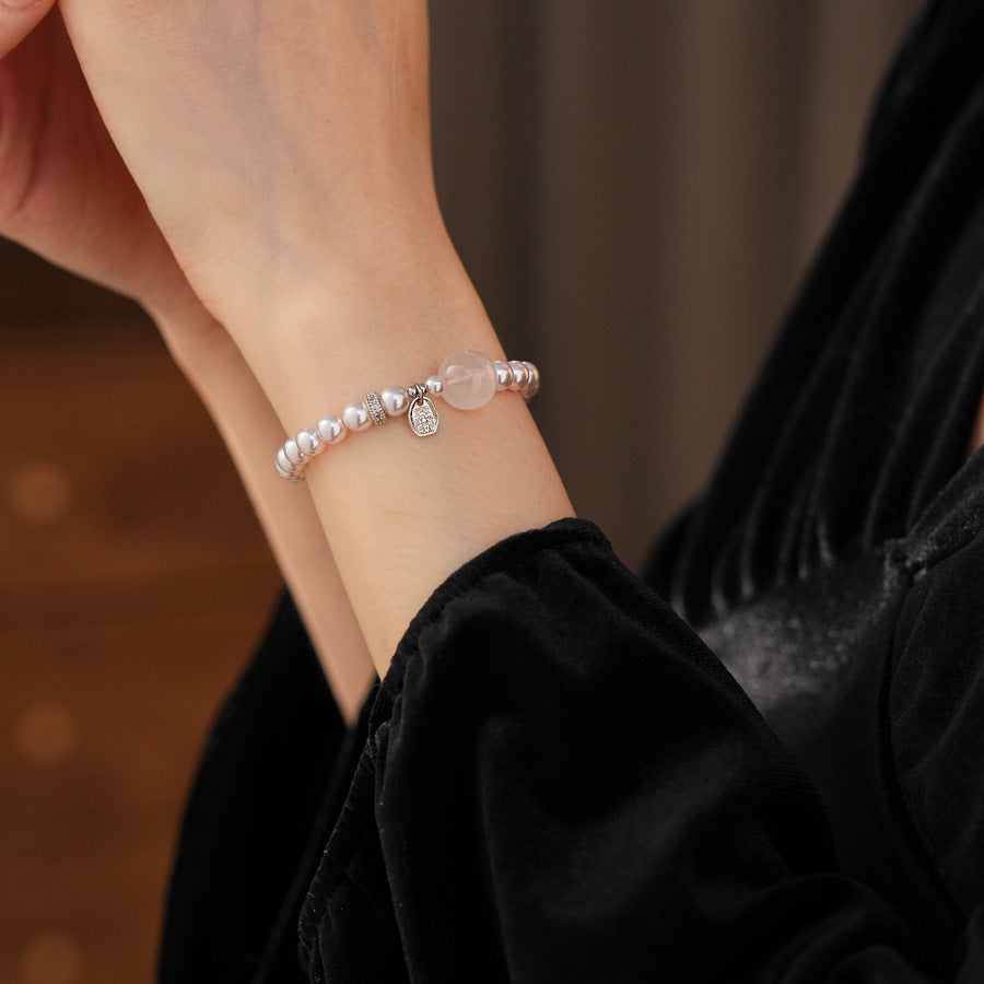 Shijia pearl beaded bracelet with crystal orb focal, zircon spacer and silver-tone coin charm — Moonlit Pearl Charm Bracelet.