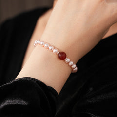 Blush Shijia pearl bracelet with a crimson agate centerpiece and pavé spacers — Crimson Kiss Pearl Bracelet by Glazenya.
