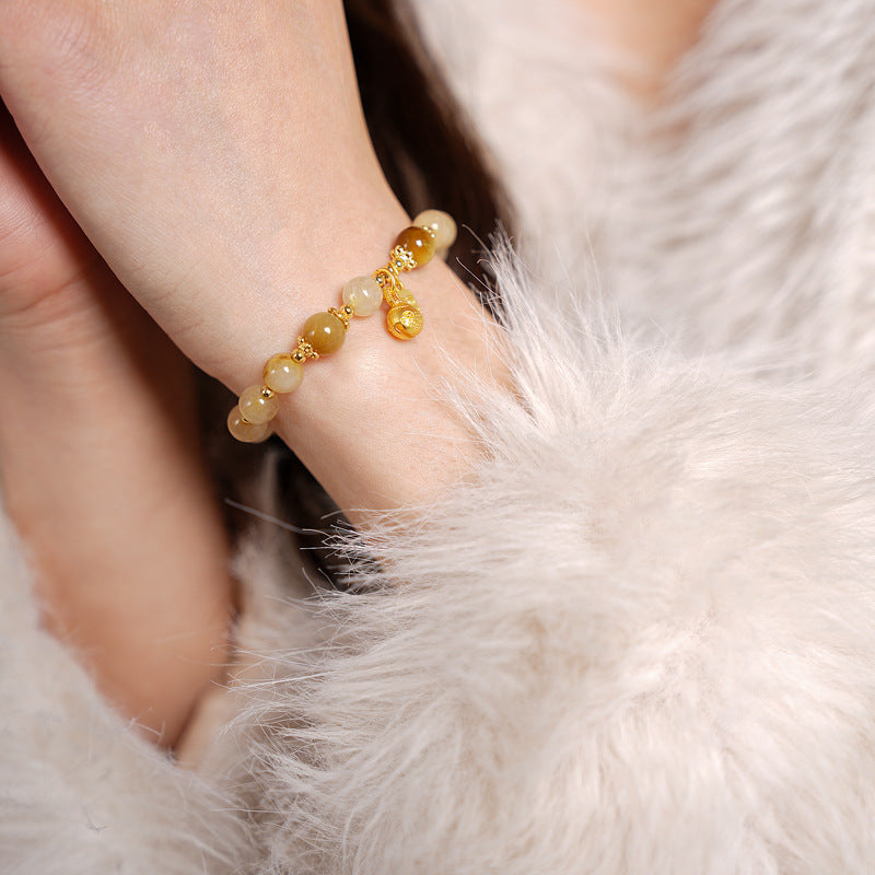 Crystal beaded bracelet with gold-tone accents and fortune & ingot charms, light-luxury style