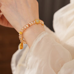 Faceted champagne crystal beaded bracelet with gold-tone pavé gourd charm — Champagne Crystal Gourd Charm Bracelet.