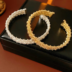 Gold and silver textured open cuff bangles with a lace-like granulated surface — Starlit Lace Cuff Bracelet.