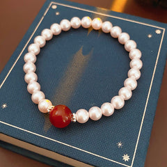 Blush Shijia pearl bracelet with a crimson agate centerpiece and pavé spacers — Crimson Kiss Pearl Bracelet by Glazenya.