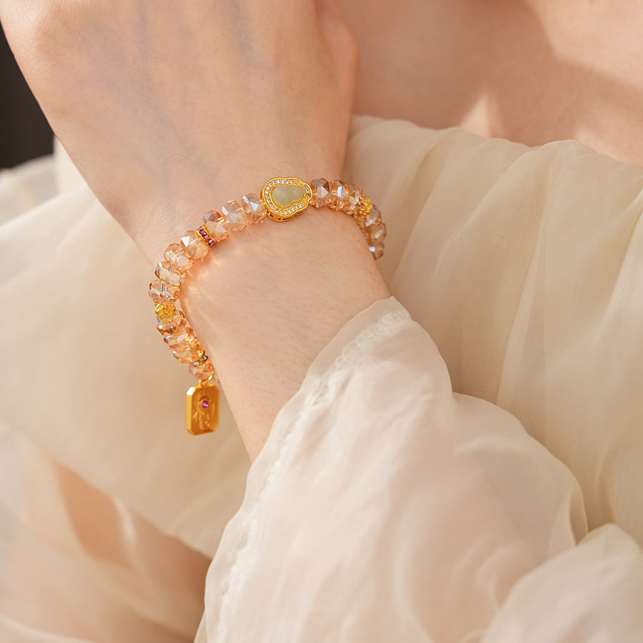 Faceted champagne crystal beaded bracelet with gold-tone pavé gourd charm — Champagne Crystal Gourd Charm Bracelet.
