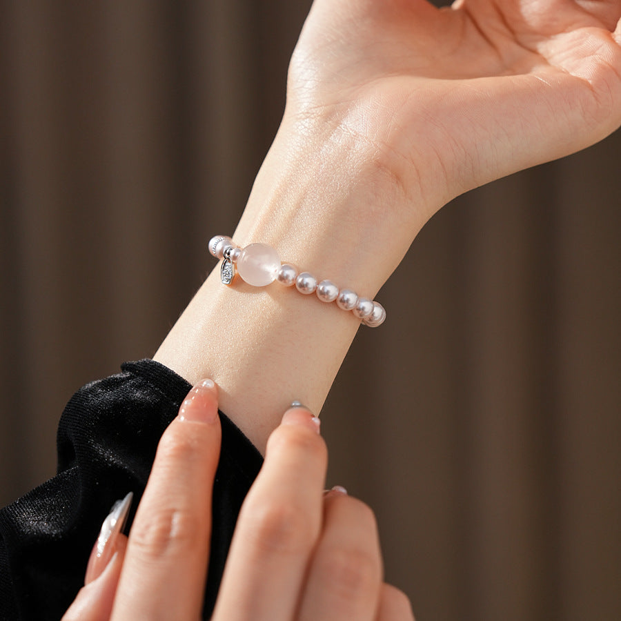 Shijia pearl beaded bracelet with crystal orb focal, zircon spacer and silver-tone coin charm — Moonlit Pearl Charm Bracelet.