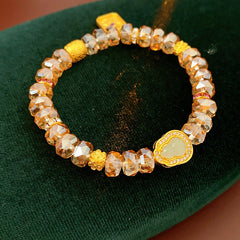 Faceted champagne crystal beaded bracelet with gold-tone pavé gourd charm — Champagne Crystal Gourd Charm Bracelet.