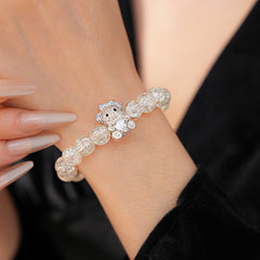 Clear crackle-glass beaded bracelet with pavé bear charm holding a heart — Glacial Heart Bear Bracelet.