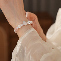 Rosy Heart Pearl Bracelet with pink crystal heart charm and luminous pearls on black background