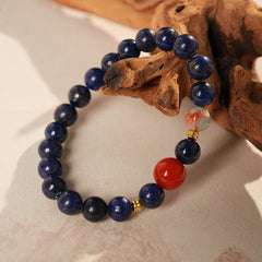 Lapis lazuli beaded bracelet with red accent bead and gold spacers — Midnight Sun Lapis Bracelet by Glazenya.
