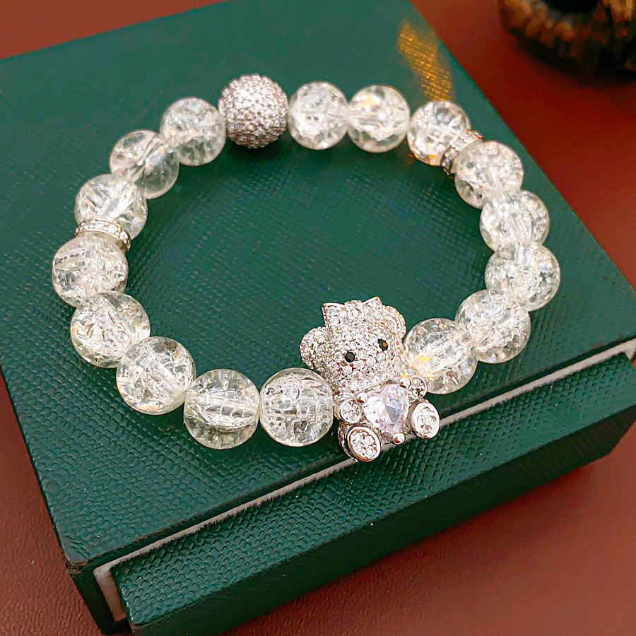 Clear crackle-glass beaded bracelet with pavé bear charm holding a heart — Glacial Heart Bear Bracelet.