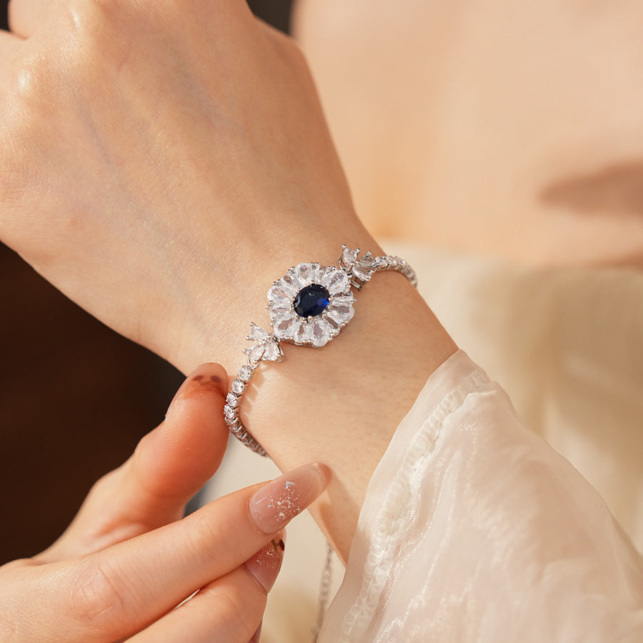 Starlit Dahlia Bracelet with blue oval gemstone and zircon floral halo – Glazenya jewelry