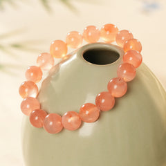 Peach-toned natural red agate beaded bangle with glossy round stones — Peach Glow Agate Bangle.