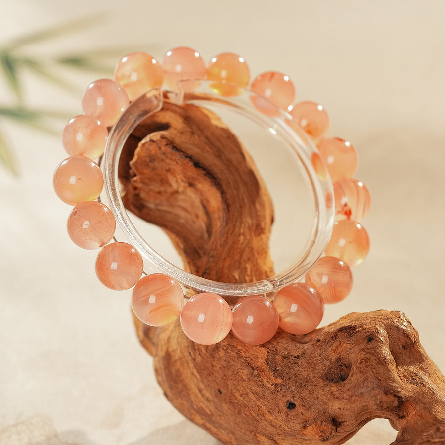 Peach-toned natural red agate beaded bangle with glossy round stones — Peach Glow Agate Bangle.