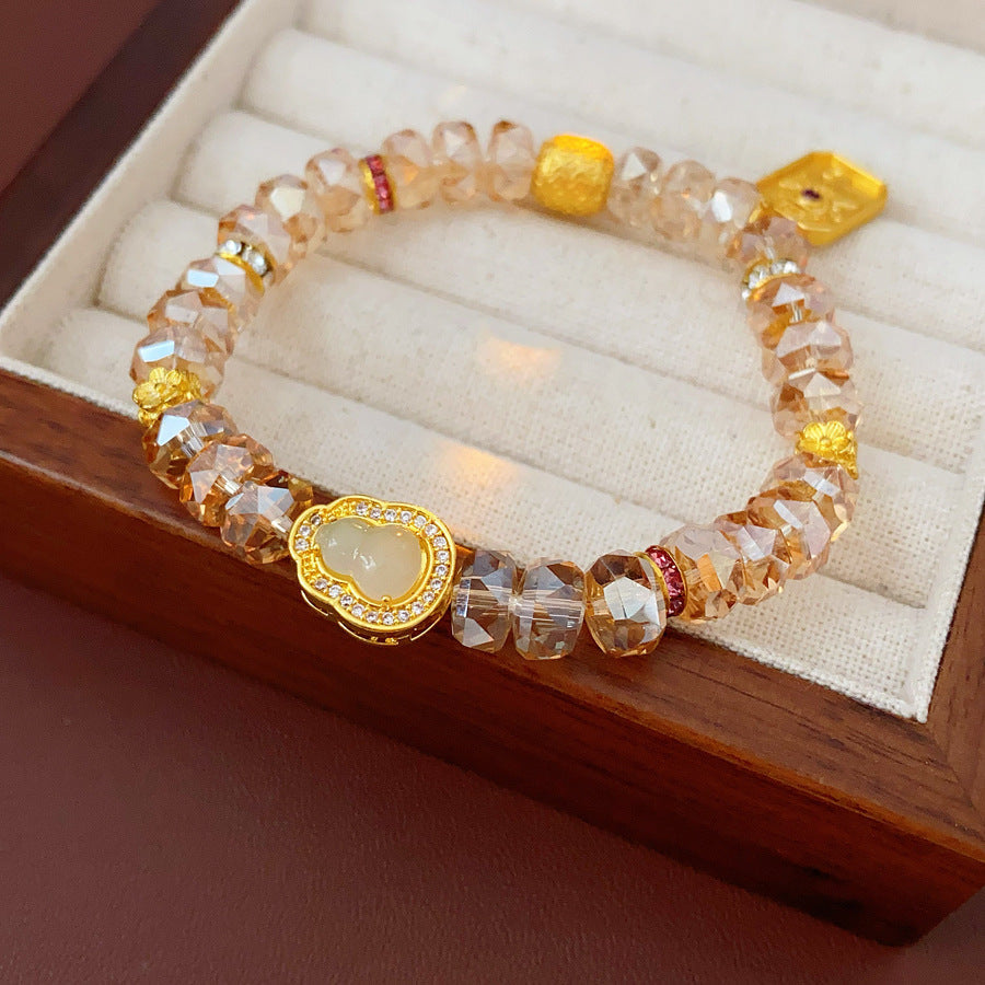 Faceted champagne crystal beaded bracelet with gold-tone pavé gourd charm — Champagne Crystal Gourd Charm Bracelet.