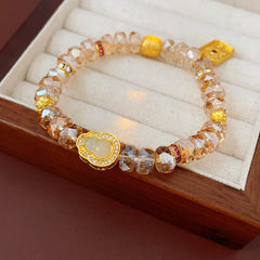 Faceted champagne crystal beaded bracelet with gold-tone pavé gourd charm — Champagne Crystal Gourd Charm Bracelet.