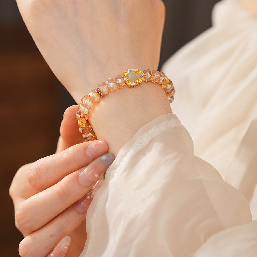 Faceted champagne crystal beaded bracelet with gold-tone pavé gourd charm — Champagne Crystal Gourd Charm Bracelet.