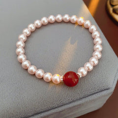 Blush Shijia pearl bracelet with a crimson agate centerpiece and pavé spacers — Crimson Kiss Pearl Bracelet by Glazenya.