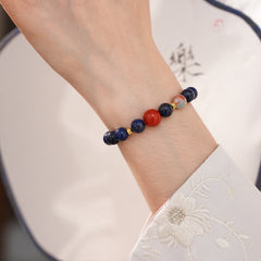 Lapis lazuli beaded bracelet with red accent bead and gold spacers — Midnight Sun Lapis Bracelet by Glazenya.