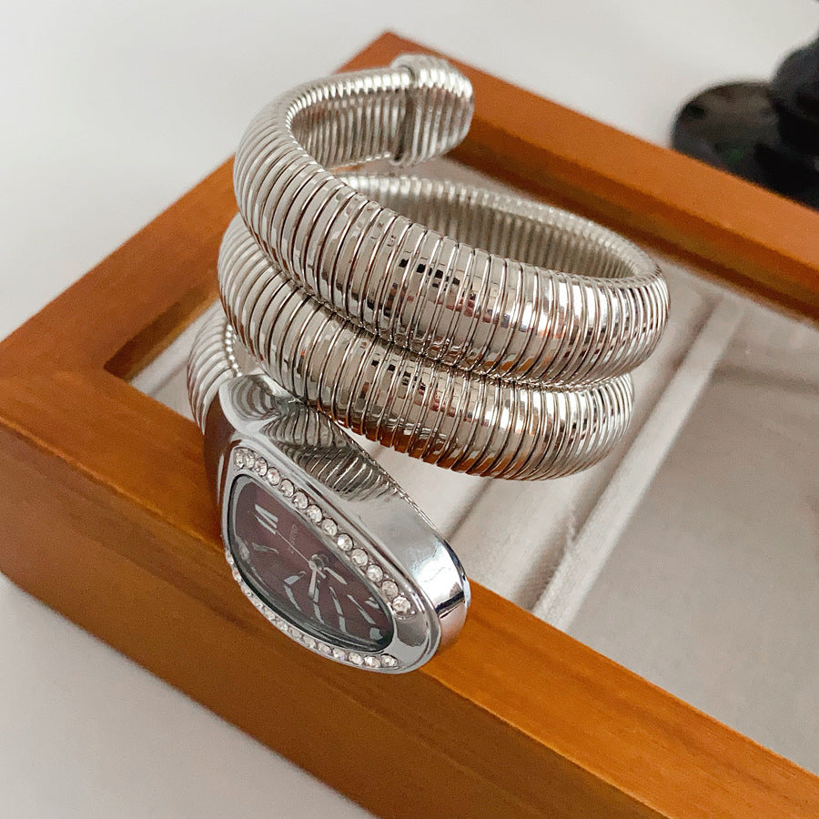 Silver tubular coil wrap cuff bracelet with pavé teardrop end cap — Serpentine Coil Wrap Cuff by Glazenya.