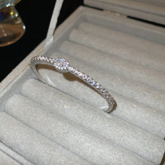 Elegant open bangle in gold with sparkling zircon stones and a marquise centerpiece, light-luxury adjustable bracelet.