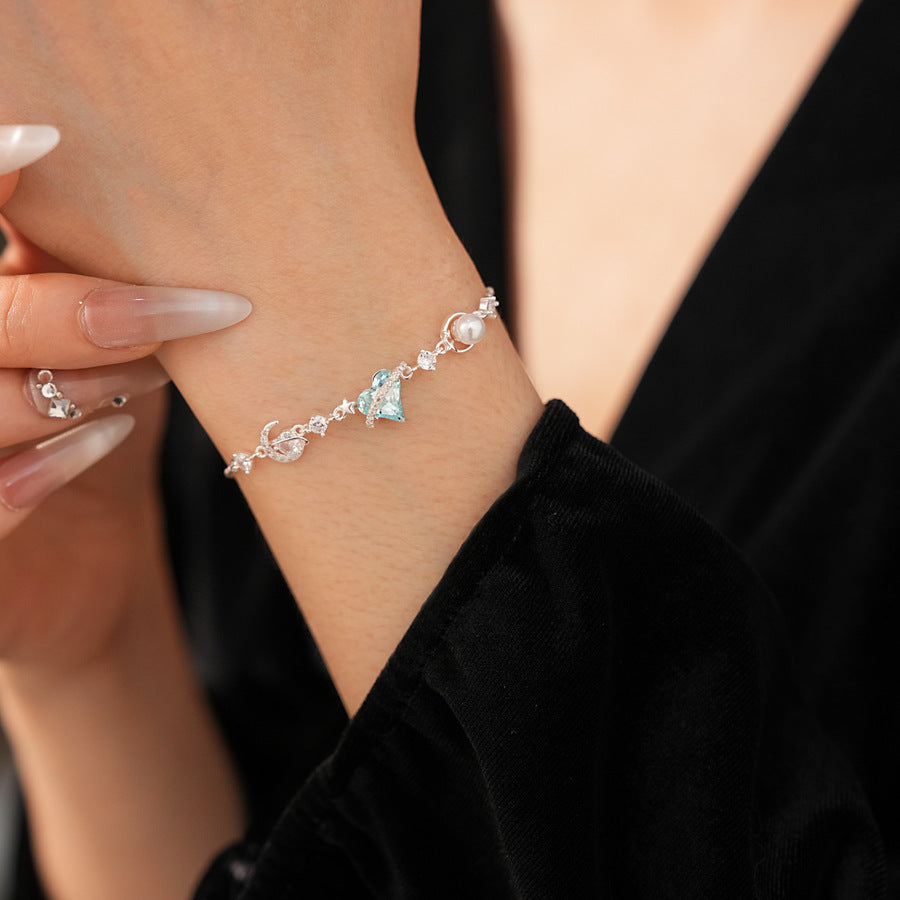 Aqua Moon Charm Bracelet with blue heart zircon, moon and star charms, and pearl detail – Glazenya jewelry