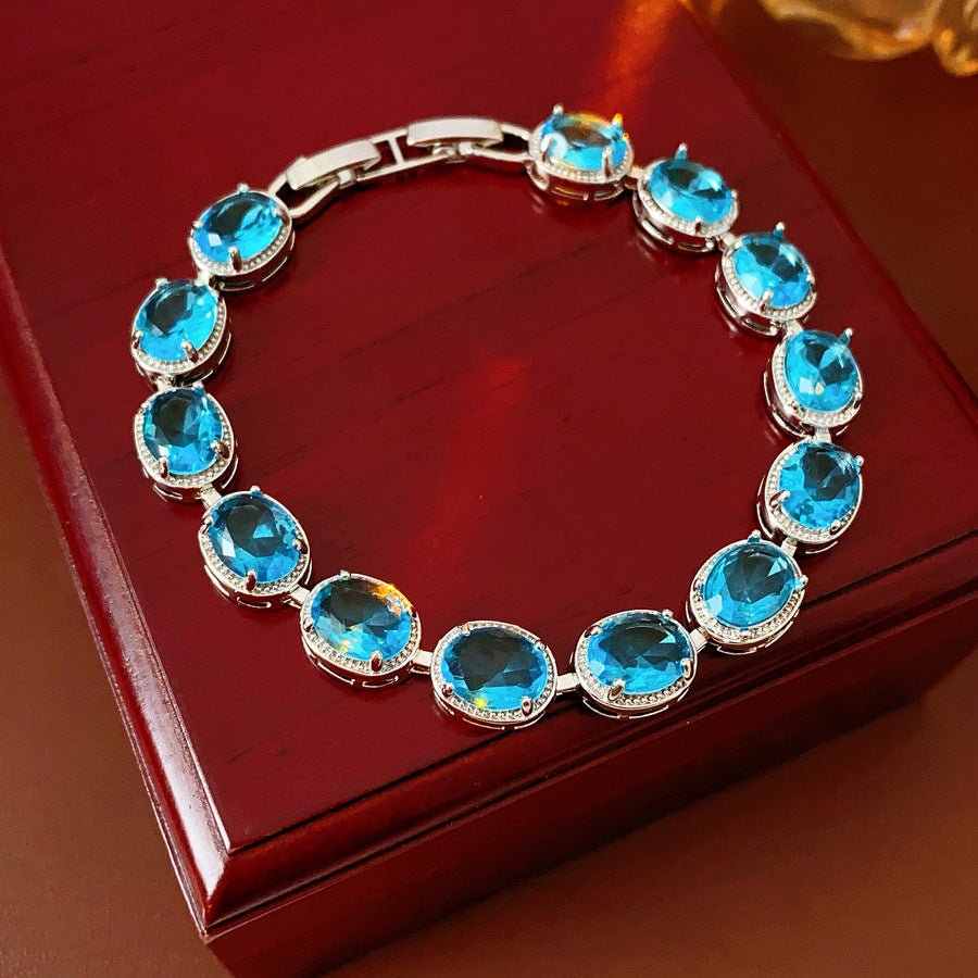 Silver-tone tennis bracelet with oval blue zircon stones — Azure Oval Zircon Tennis Bracelet.