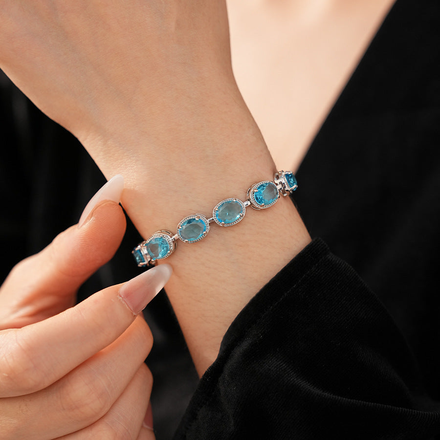 Silver-tone tennis bracelet with oval blue zircon stones — Azure Oval Zircon Tennis Bracelet.