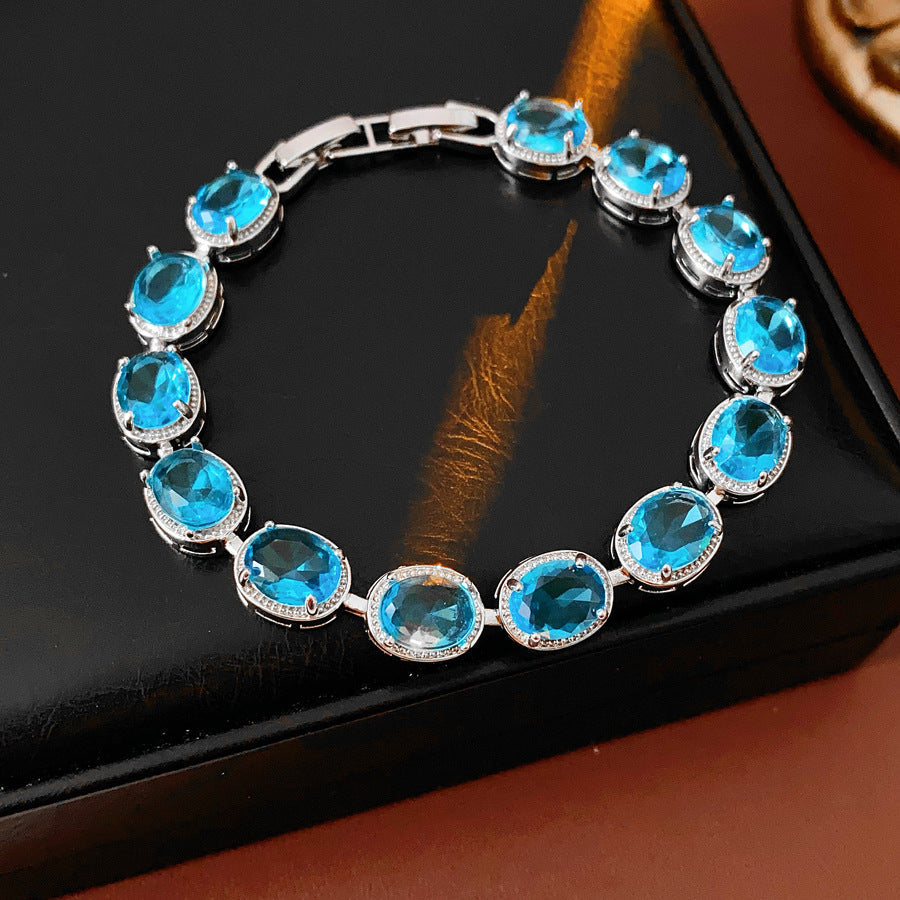 Silver-tone tennis bracelet with oval blue zircon stones — Azure Oval Zircon Tennis Bracelet.