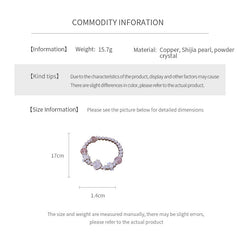 Rosy Heart Pearl Bracelet with pink crystal heart charm and luminous pearls on black background