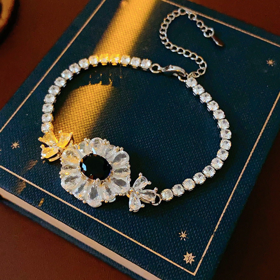 Starlit Dahlia Bracelet with blue oval gemstone and zircon floral halo – Glazenya jewelry