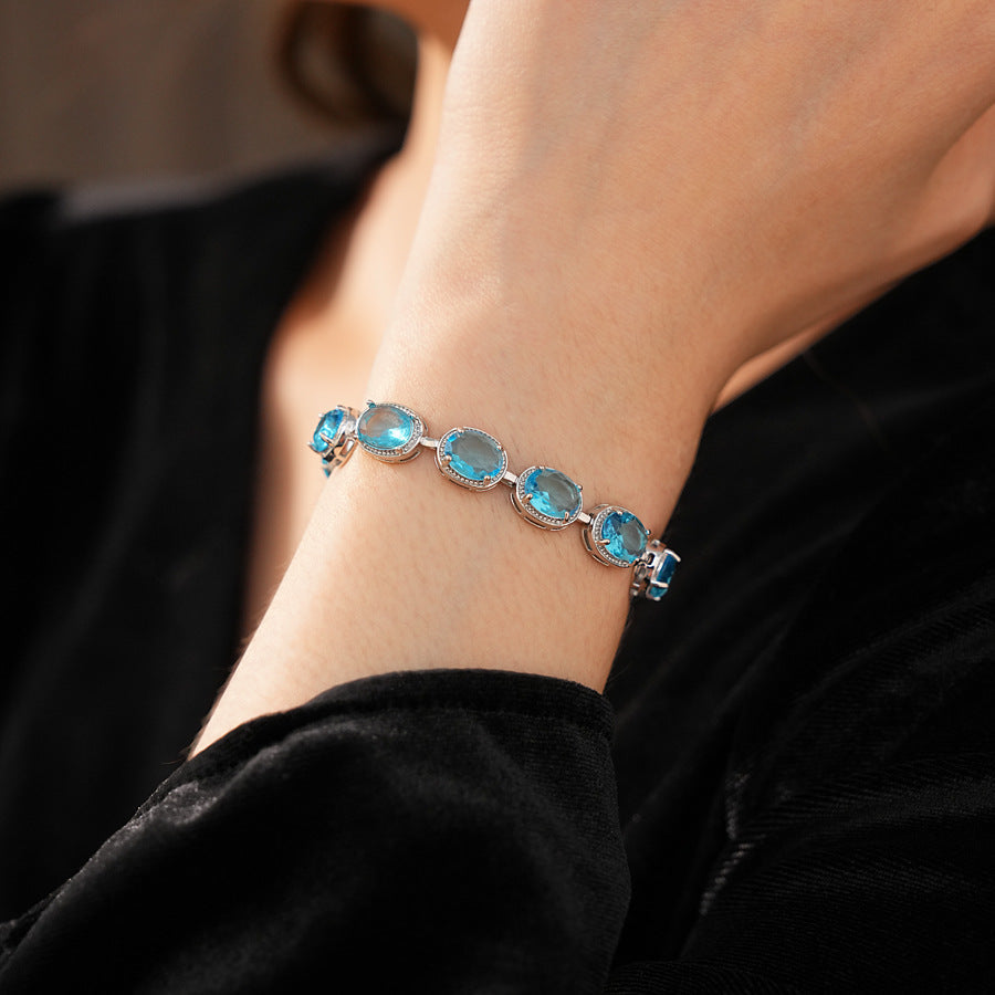 Silver-tone tennis bracelet with oval blue zircon stones — Azure Oval Zircon Tennis Bracelet.