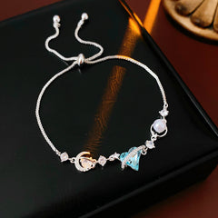 Aqua Moon Charm Bracelet with blue heart zircon, moon and star charms, and pearl detail – Glazenya jewelry