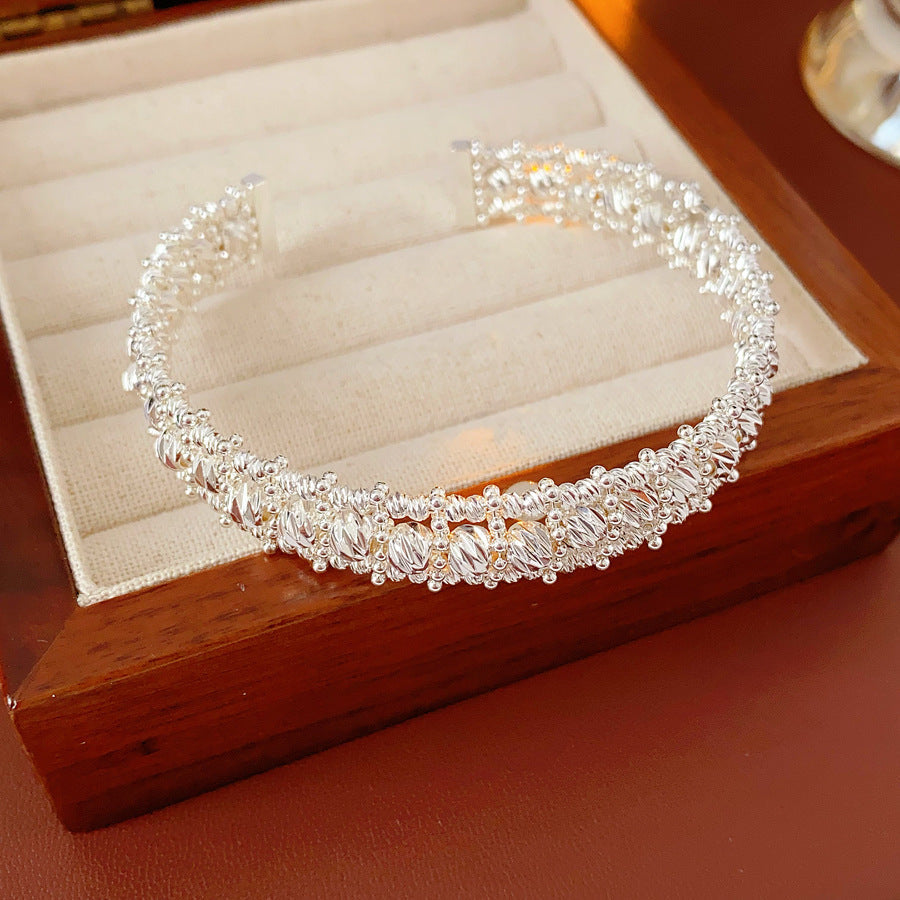 Gold and silver textured open cuff bangles with a lace-like granulated surface — Starlit Lace Cuff Bracelet.