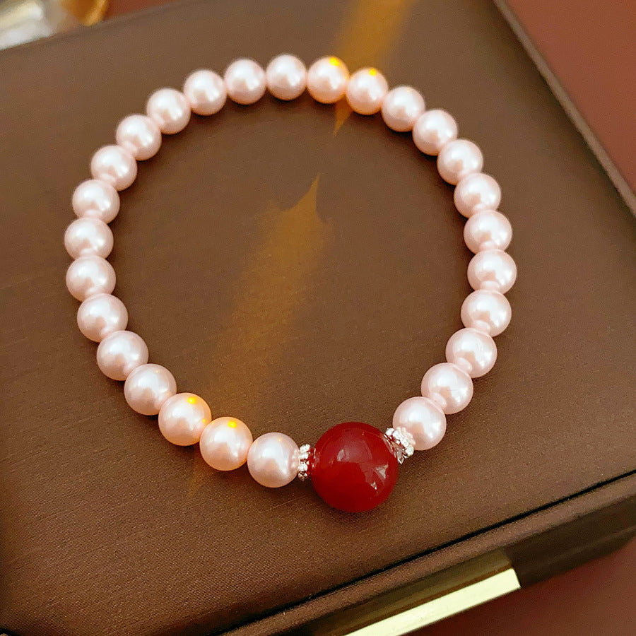 Blush Shijia pearl bracelet with a crimson agate centerpiece and pavé spacers — Crimson Kiss Pearl Bracelet by Glazenya.