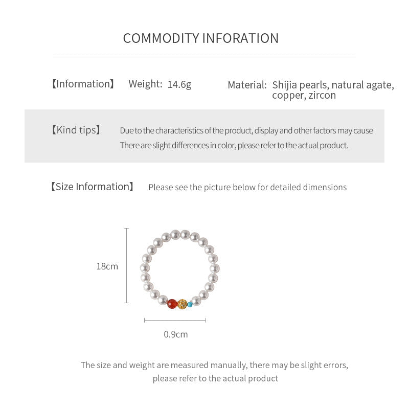 White/blush Shijia pearl bracelet featuring a red agate bead, gold zircon bead, and small blue accent — Trio Charm Pearl Bracelet by Glazenya.