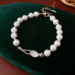 Serpentine Pearl Elegance Bracelet with glass pearls and shell accents on green box – Glazenya jewelry