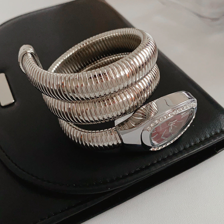 Silver tubular coil wrap cuff bracelet with pavé teardrop end cap — Serpentine Coil Wrap Cuff by Glazenya.