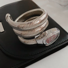 Silver tubular coil wrap cuff bracelet with pavé teardrop end cap — Serpentine Coil Wrap Cuff by Glazenya.